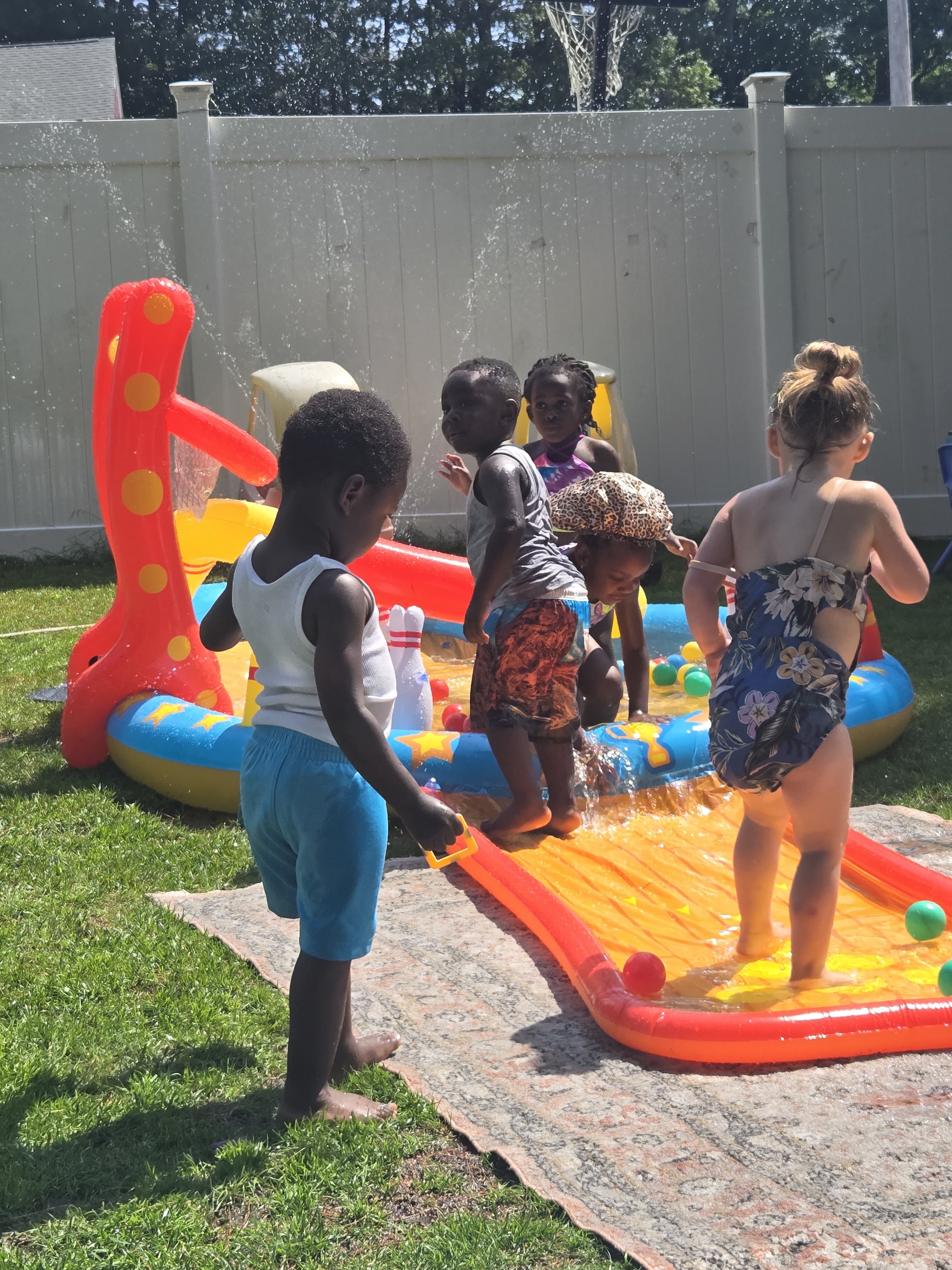 Students playing with water outside
