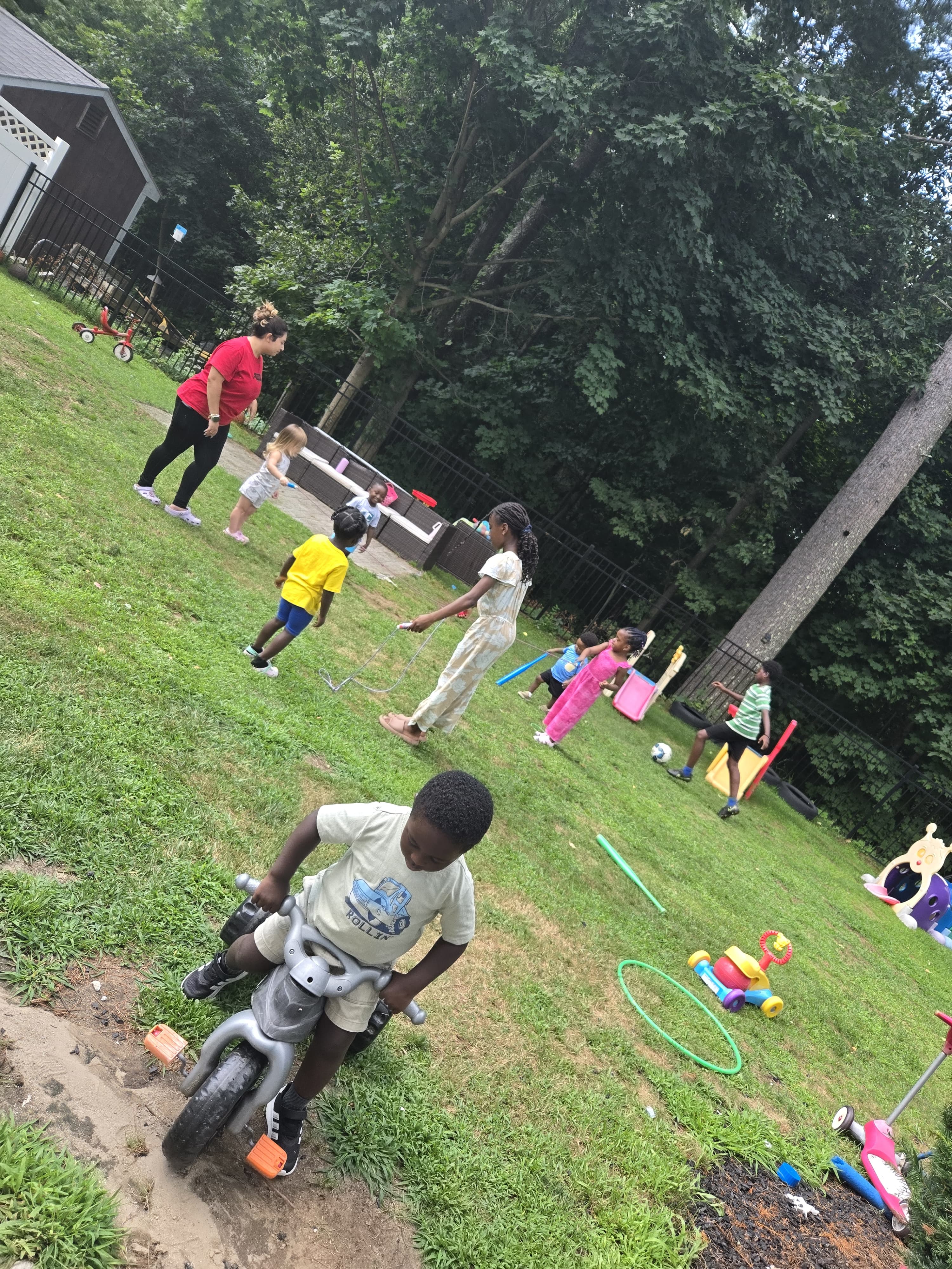 Students playing with toys outside