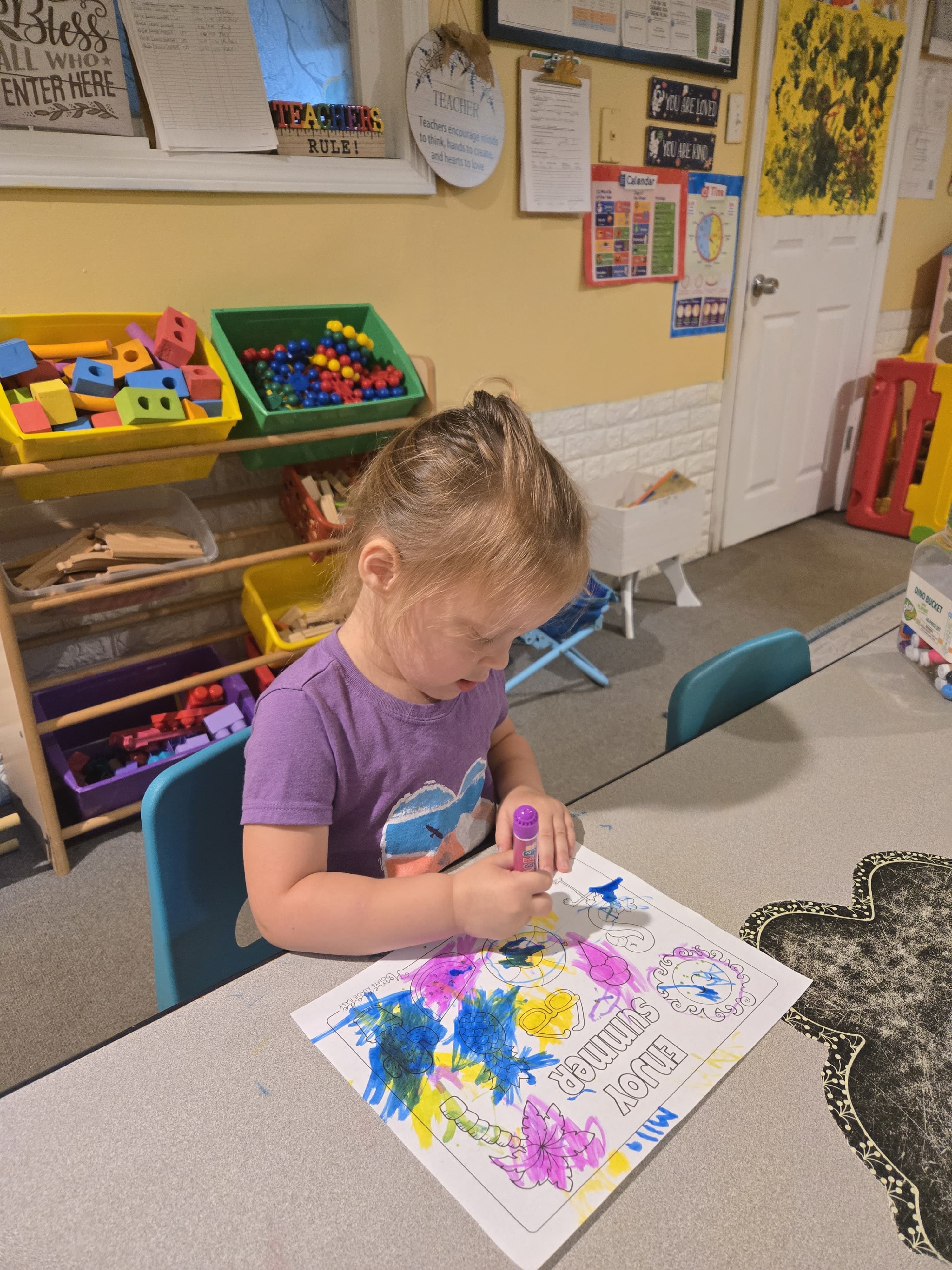 Student painting in classroom